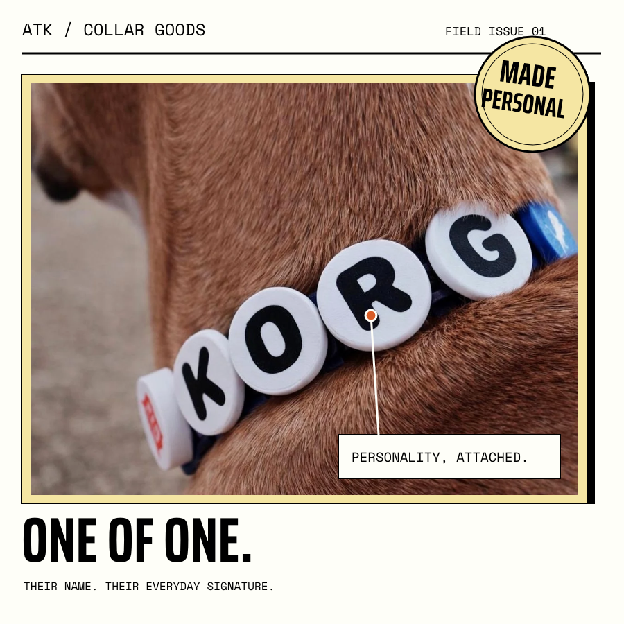 Korg wearing his name charms, presented on a custom ATK product plate: One of one. Their name. Their everyday signature.